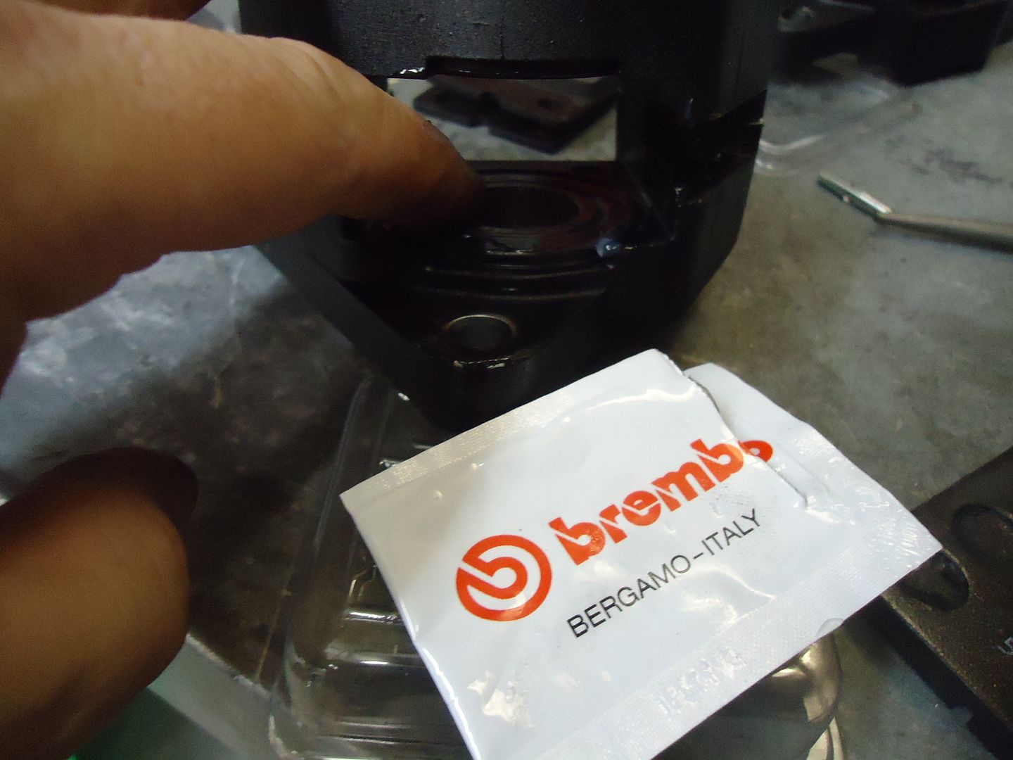 Brembo P08 caliper leak...a question (more leaks!).